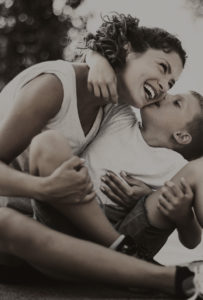 Mother and son taking break from basketball